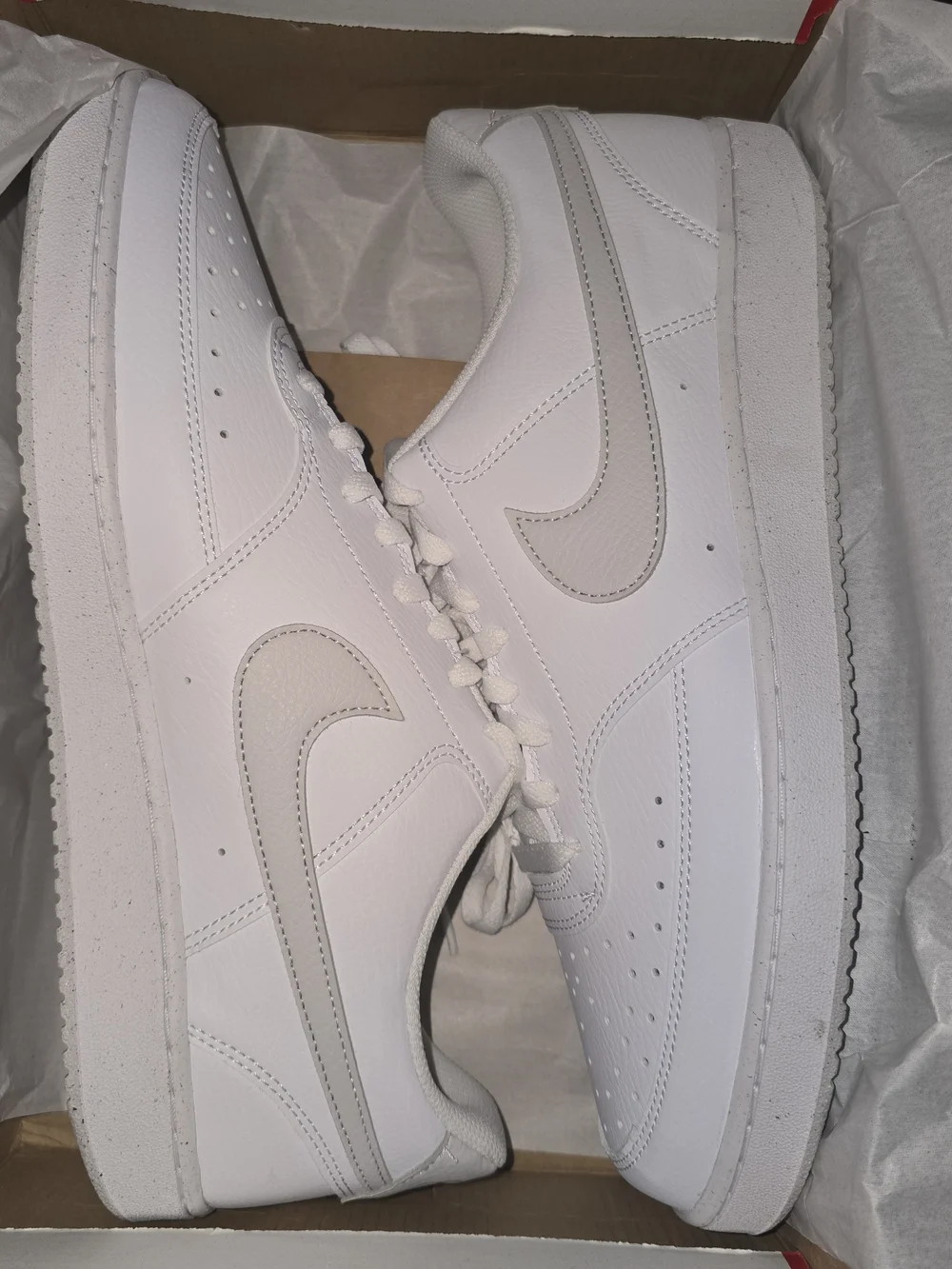 Nike White Low-Top Sneakers with Light Gray Swoosh